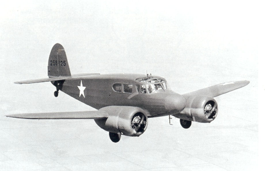 Cessna AT-17 Bobcat advanced twin trainer in flight, period photograph